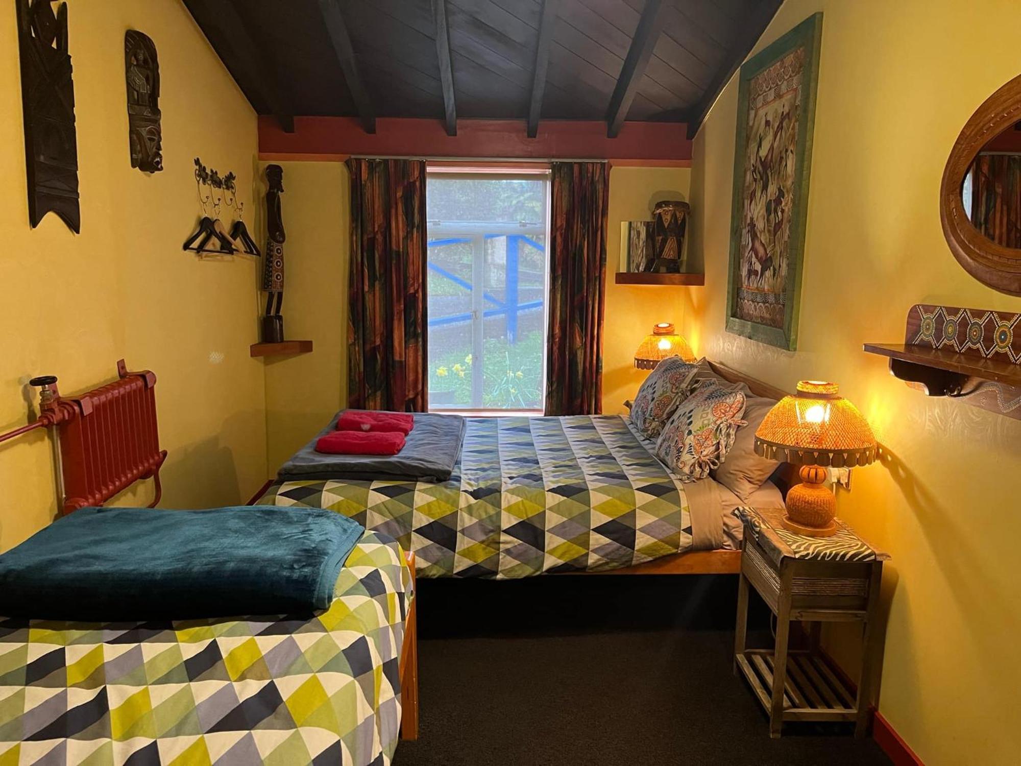 Global Village Travellers Lodge Greymouth Exterior foto The bedroom at the Old School House
